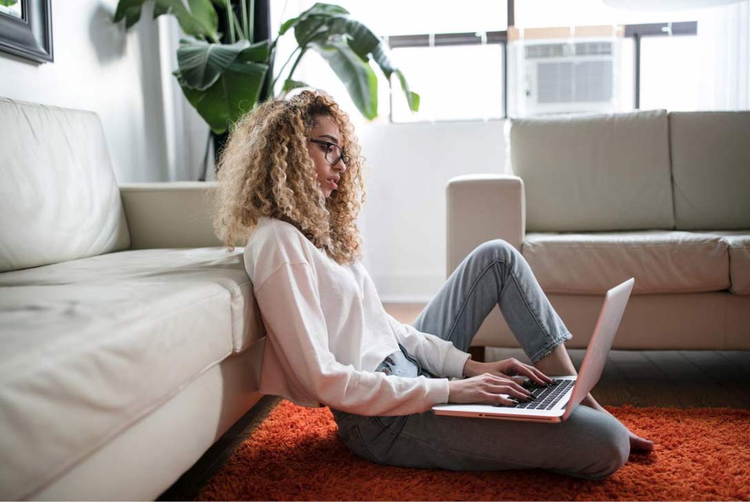 A woman in Utah looking up personal loans on the computer